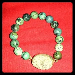 Beaded bracelet with gold charm by BLU